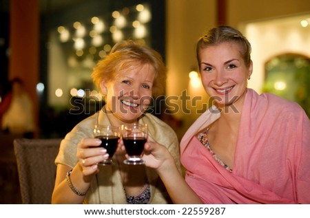 Two beautiful women celebrating