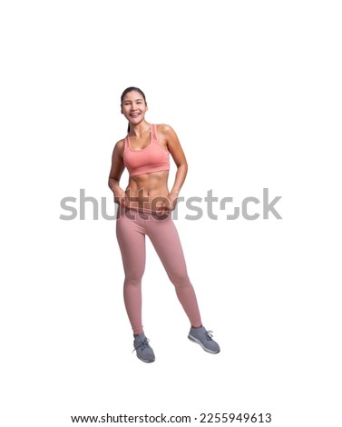 Shot of young sporty Asian woman fitness model in pink-top sportswear standing in a relaxed pose. isolated on white background. Fitness and healthy lifestyle concept.