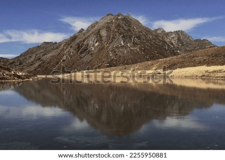 panoramic view of beautiful sela lake, reflection of himalayan mountain peak on water, sela pass, tawang, arunachal pradesh in north east india Royalty-Free Stock Photo #2255950881
