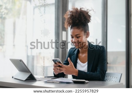 Attractive young business woman african american stock market trader and research solutions for online brokerage, clearing firms, banks, media portals, public companies Royalty-Free Stock Photo #2255957829