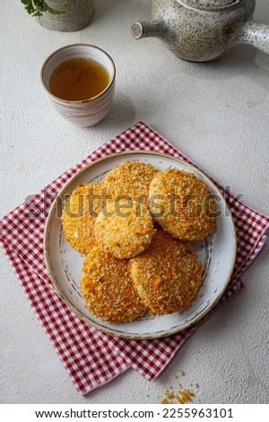 Delicious homemade fried bread on white ceramic on  white wooden table
