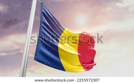 Chad national flag waving in the sky.