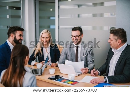 A group of businesspeople having briefing about economy in meeting room. Royalty-Free Stock Photo #2255973709