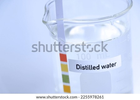 Distilled water in bottle ,sample pH water in the laboratory and industry Royalty-Free Stock Photo #2255978261