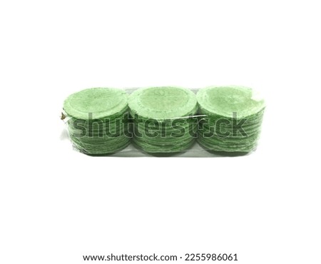 Simping cake is a typical snack of Purwakarta, West Java, made from tapioca flour, wheat plus flavoring seasonings and various flavors of spices and fruits. This simping is pandan leaves flavor. Royalty-Free Stock Photo #2255986061