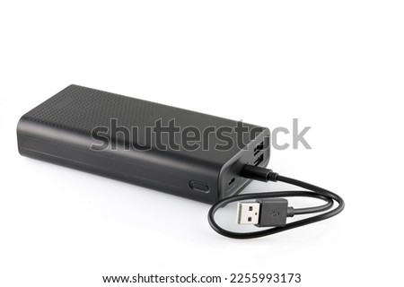 Additional self-contained external battery for charging mobile and other device. Power bank isolated on white background. Stylish charger (rechargeable battery) . Full depth of field. Royalty-Free Stock Photo #2255993173