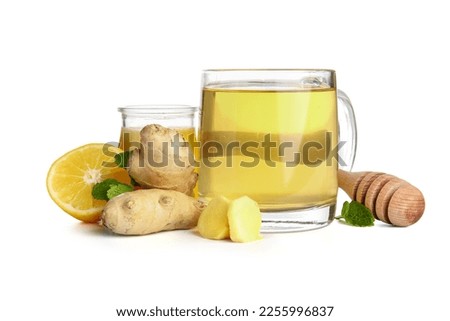 Fresh ginger roots, lemon, honey and cup of tea isolated on white background