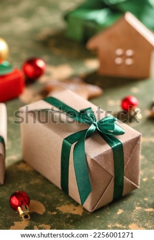 Beautiful Christmas gift box on color table