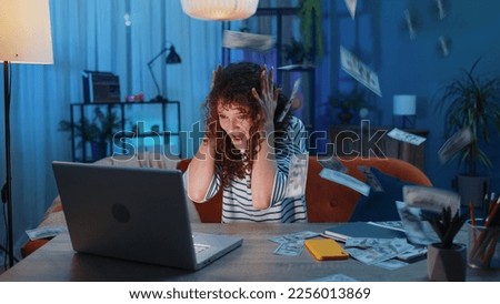 Money cash dollar rain falling on young woman celebrating success, winning, goal achievement, good news, lottery jackpot luck at modern home office apartment indoors. Career grow. Girl at home office