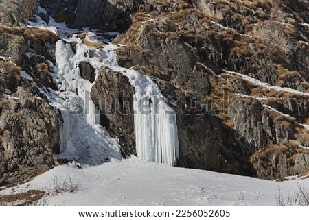 Iced waterfall in the Salarno valley.  Saviore dell'Adamello, Province of Brescia, Italy Royalty-Free Stock Photo #2256052605