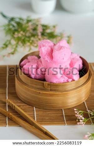 Kue mangkok, kue apem, huat kue, fa gao or steamed cupcakes is a special cakes during Chinese new year celebrations. This cake is believed to be a fortune cake. Royalty-Free Stock Photo #2256083119