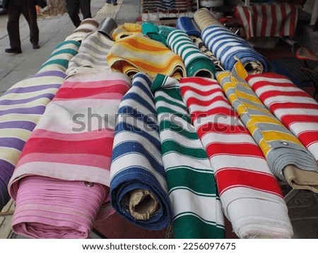 Colorful striped fabrics sold in the market