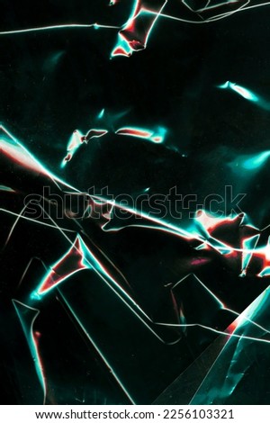 Beautiful darkness plastic abstract background. Freeze motion of dark powder exploding. Glossy polyethylene. plastic transparent. Space for text. 