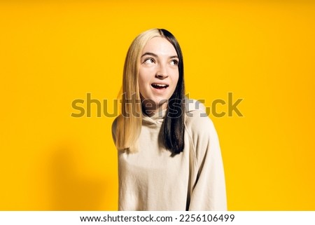Stock photo of young happy girl posing in studio.