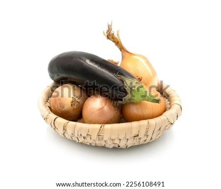 a set of vegetables on a white background with the use of decor and natural wood in a wicker basket