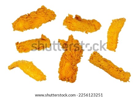 Golden fried chicken strips in different angles isolated on a white background. 