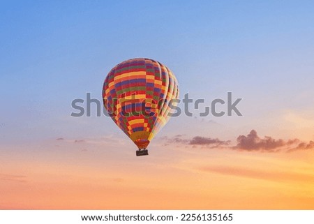 Landscape of fabulous Kapadokya. Colorful flying air balloon in sky at sunrise in Anatolia. Vacations in beautiful destination in Goreme, Turkey  Royalty-Free Stock Photo #2256135165