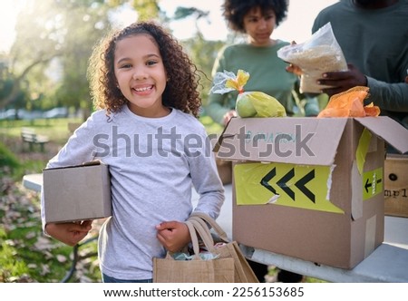Food, donation and portrait of child in park with smile and grocery box, healthy diet at refugee feeding project. Girl, charity and donations help feed children and support from farm volunteer at ngo Royalty-Free Stock Photo #2256153685