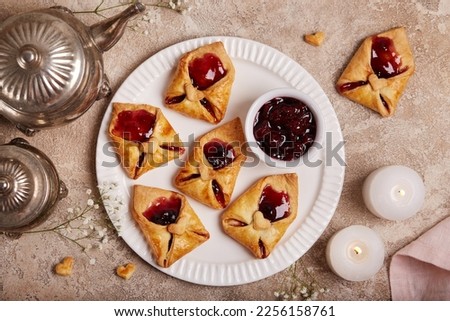 Love letter cookies. Envelopes with cherry jam filling decorated with hearts. Dessert for Valentine day. Royalty-Free Stock Photo #2256158761