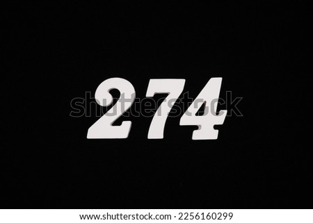 white numbers on a black background Made of white spray-painted wood, placed on a black velvet cloth, making the figures stand out beautifully.