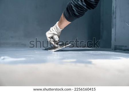 waterproofing of the bathroom floor in a new building Royalty-Free Stock Photo #2256160415