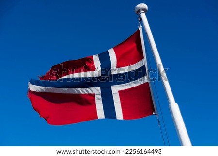 Norwegian flag waving in the wind Royalty-Free Stock Photo #2256164493