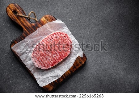 frozen meat cutlets minced meat pork, beef, chicken fast food semifinished meal food snack on the table copy space food background rustic top view Royalty-Free Stock Photo #2256165263