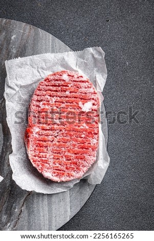 frozen meat cutlets minced meat pork, beef, chicken fast food semifinished meal food snack on the table copy space food background rustic top view Royalty-Free Stock Photo #2256165265