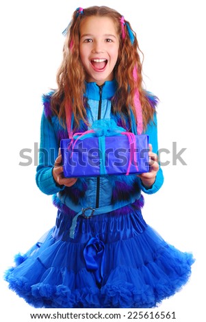 Surprised girl with a gift on isolated background