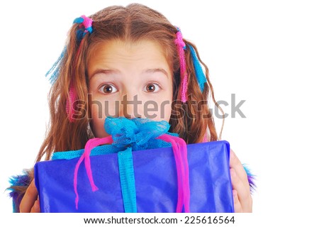 Surprised girl with a gift on isolated background