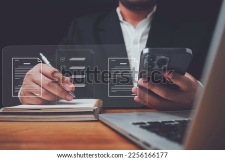 E-document management Paperless workplace, e-signing, electronic signature, document management man signs an electronic document on digital document by virtual notebook screen using a stylus pen.
