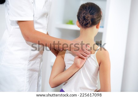 Chiropractor doing adjustment on female patient Royalty-Free Stock Photo #225617098