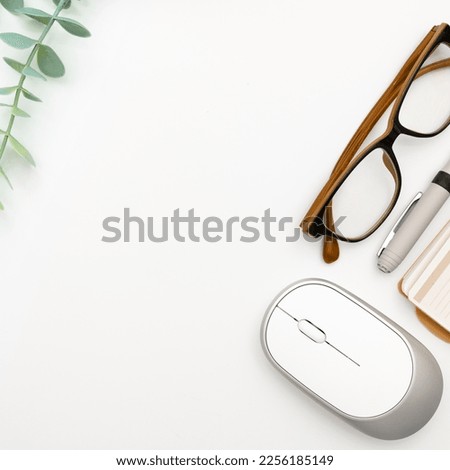 Office Supplies Over Desk With Keyboard And Glasses And Coffee Cup For Working Remotely, Assorted School Utilities For Studying With Hot Drink And Eyeglasses.
