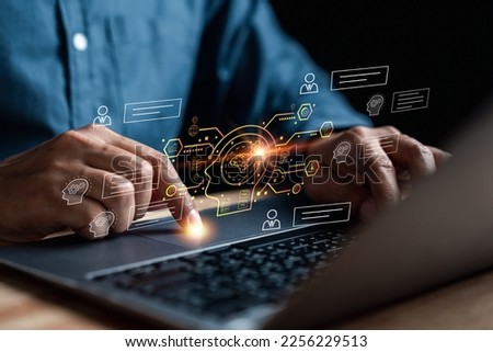 Chat with AI Artificial Intelligence. Businessman using chatbot in computer smart intelligence Ai, artificial intelligence developed by OpenAI. Futuristic technology, robot in online system. Royalty-Free Stock Photo #2256229513