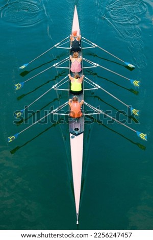 rowing boat on the Seine river with a team of 4 aboard view from above Royalty-Free Stock Photo #2256247457