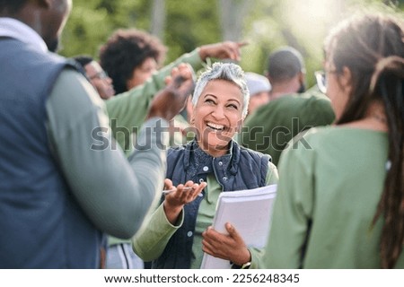 Volunteer, team and people in nature for community service, teamwork and planning with leadership, goals and strategy. Senior person or leader for management in forest, park or eco friendly project Royalty-Free Stock Photo #2256248345