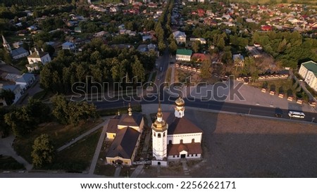 An old white-stone Orthodox church from a bird's eye view.