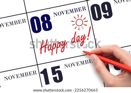 8th day of November. Hand writing the text HAPPY DAY and drawing the sun on the calendar date November 8. Save the date. Holiday. Motivation. Autumn month, day of the year concept.