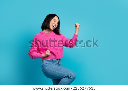 Profile photo of delighted cheerful person raise fists achieve accomplishment isolated on blue color background Royalty-Free Stock Photo #2256279615