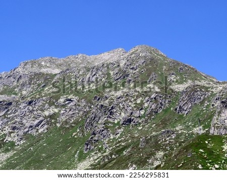 Rocky mountain peaks Poncione di Fieud (2696 m) and Fibbia (2738 m) in the massif of the Swiss Alps above the St. Gotthard Pass (Gotthardpass), Airolo - Canton of Ticino (Tessin), Switzerland (Schweiz Royalty-Free Stock Photo #2256295831
