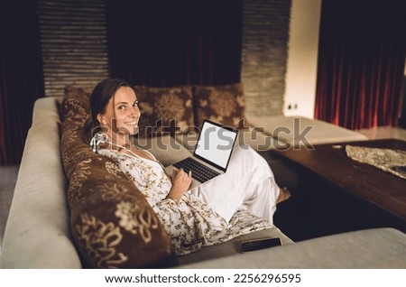 Portrait of cheerful Caucaisan woman with modern laptop computer with blank screen area smiling at camera, happy female freelancer with mockup netbook technology posing during networking time