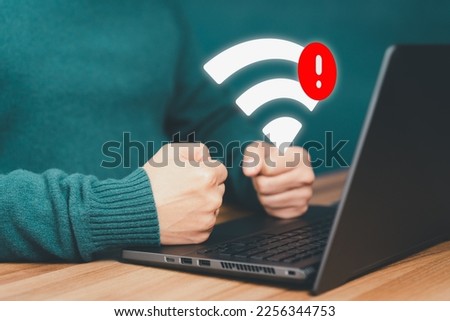 Man using a computer laptop to connect to wifi but wifi not connected, and waiting to loading digital business data form website, concept technology of waiting for connect to wifi.