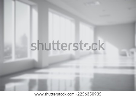 Blur background of empty modern office background . Workspace interior design white color . Clean and bright office gallery background
