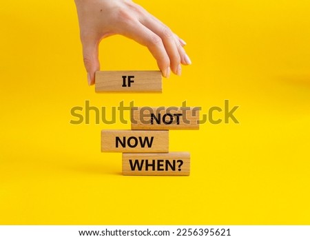 If not now when symbol. Concept words If not now when on wooden blocks. Beautiful yellow background. Businessman hand. Business and If not now when concept. Copy space.
