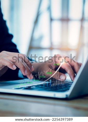 Digital investment, trading, financial business growth concepts. Increasing business stock graph appear on laptop computer using by business people trader who invest online stock market, vertical.