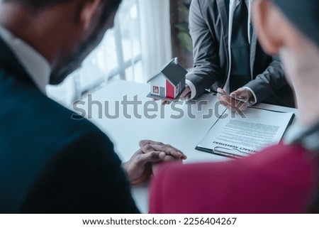 Businessperson real estate purchase agreement contract after sign official offer form is created by the homebuyer's agent and submitted to the seller