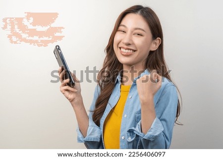 Asian young woman happy hold mobile, read good news online feel excited getting offer, great positive surprise, joy celebrate success on phone. Businesswoman isolated on white background, copy space