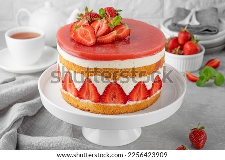 Fraisier mousse cake. Strawberry cake with sponge cake, mousse and jelly on a gray concrete background. Summer dessert. Selective focus. Copy space. Royalty-Free Stock Photo #2256423909