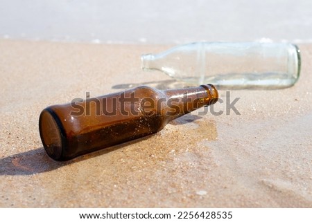 Glass bottles on the beach