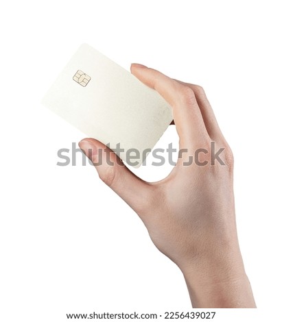Gold bank credit debit card mockup in hand isolated on white background. Electronic cashless money with chip between fingers. High quality photo Royalty-Free Stock Photo #2256439027
